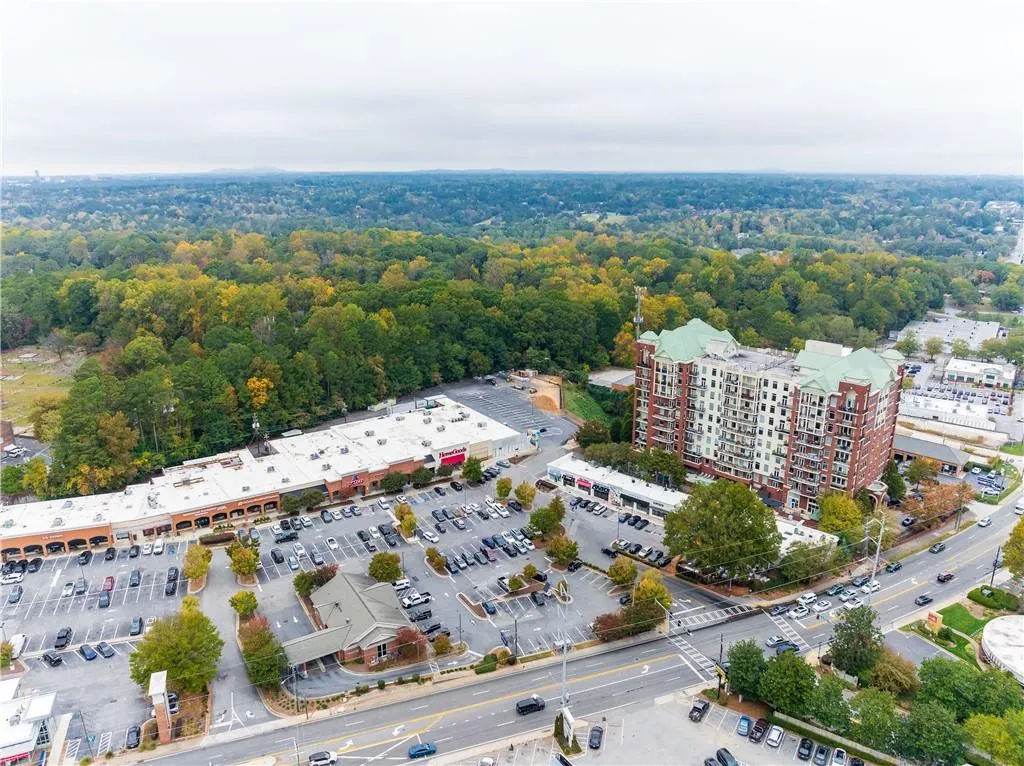 Birds eye view of property with a view of trees