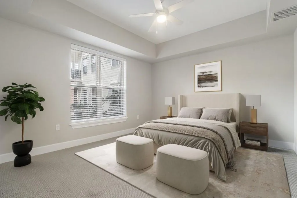 The Spacious Bedroom boasts a Tray Ceiling and a Spa-Like Ensuite Bathroom with Generous Counter Space, Ample Storage, a Soaking Tub, and a Massive Walk-In Closet.