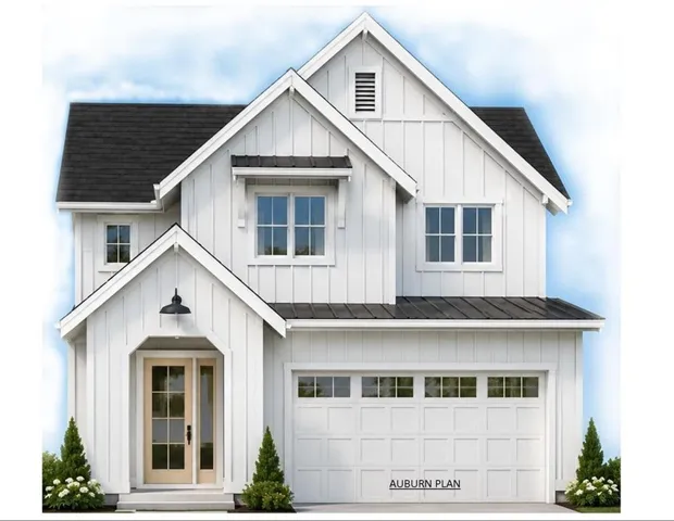 White siding exterior with multiple gables and a dark shingle roof