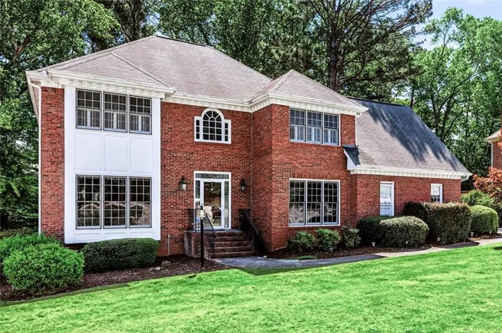 3 sides brick home