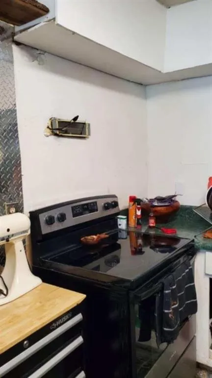 Kitchen view of black electric range