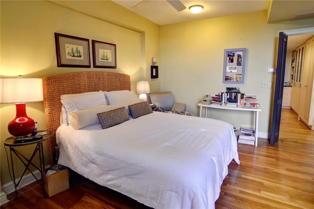 Bedroom featuring wood finished floors and baseboards