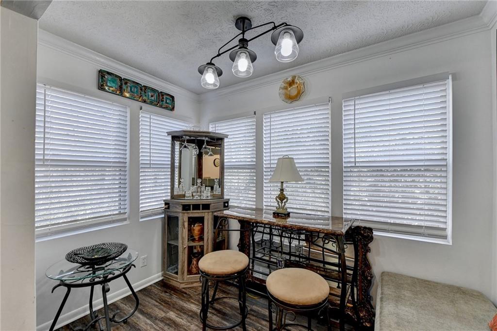 Office area/sun room with lots of natural light and view to the outside private area