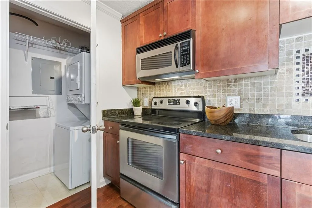 Kitchen with view of laundry/storage closet