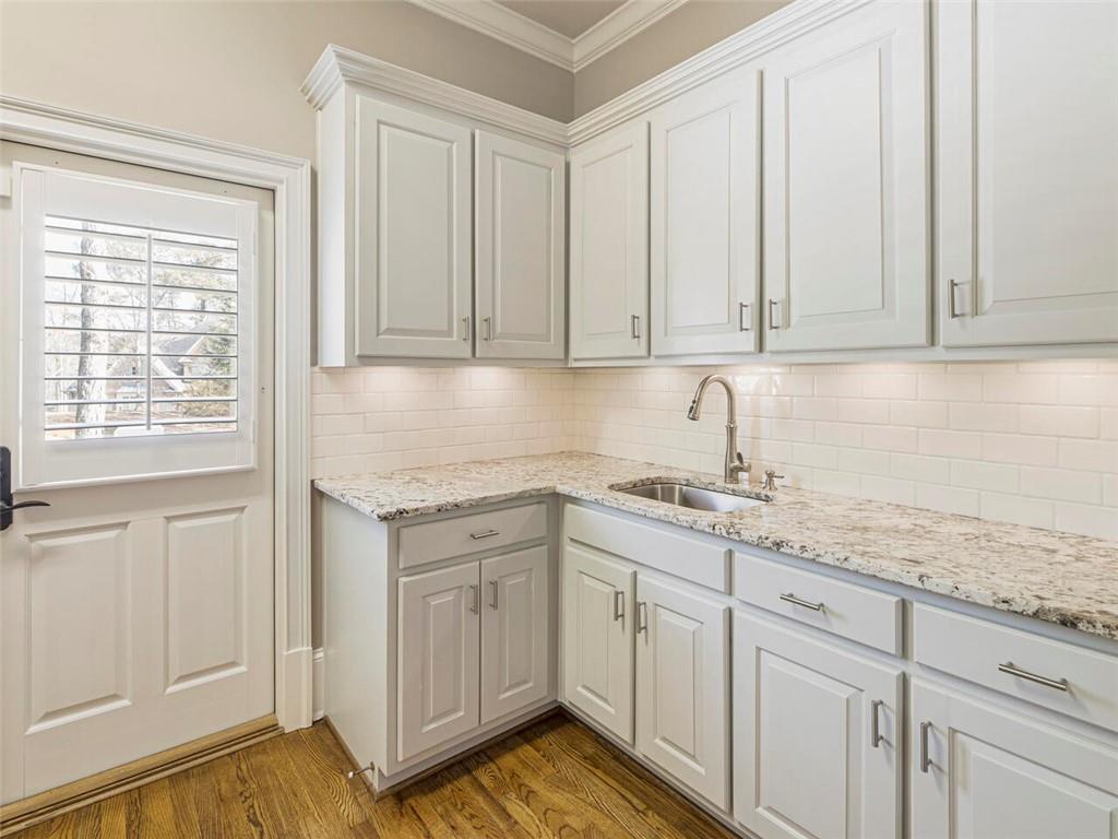 Spacious laundry/mudroom with access to driveway.