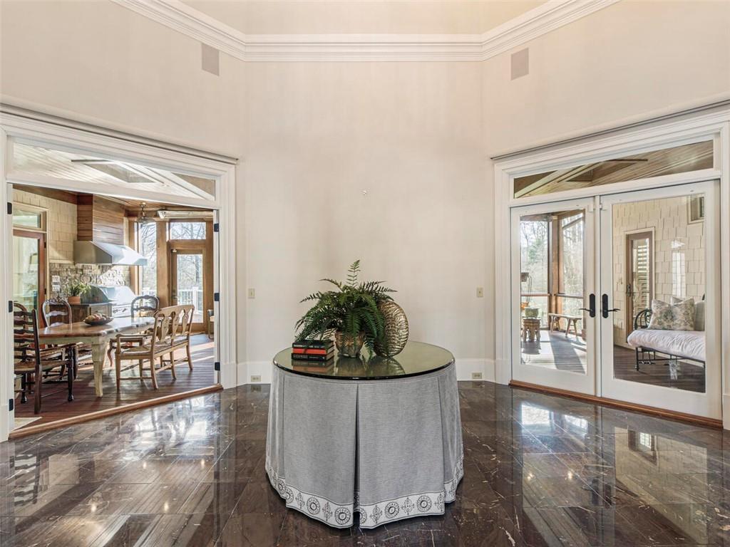 Beautiful room (perfect for a grand piano) that leads to screened in porch