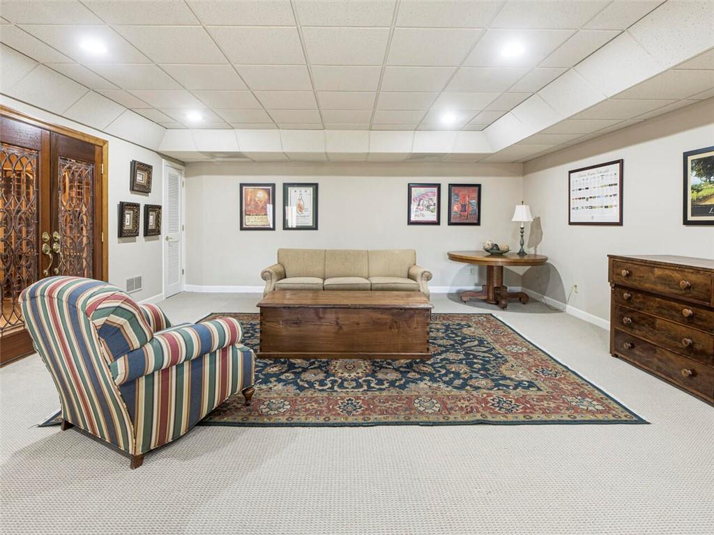 Yet another living area in the terrace level with wine cellar off to the left