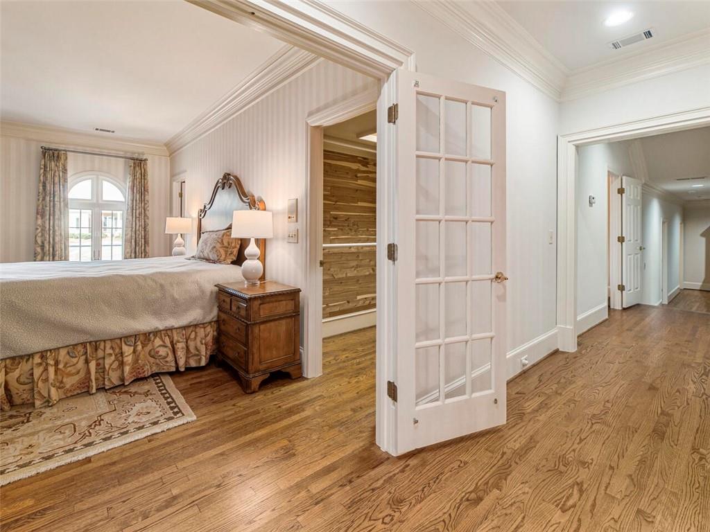 Another spacious bedroom with French doors and cedar closet