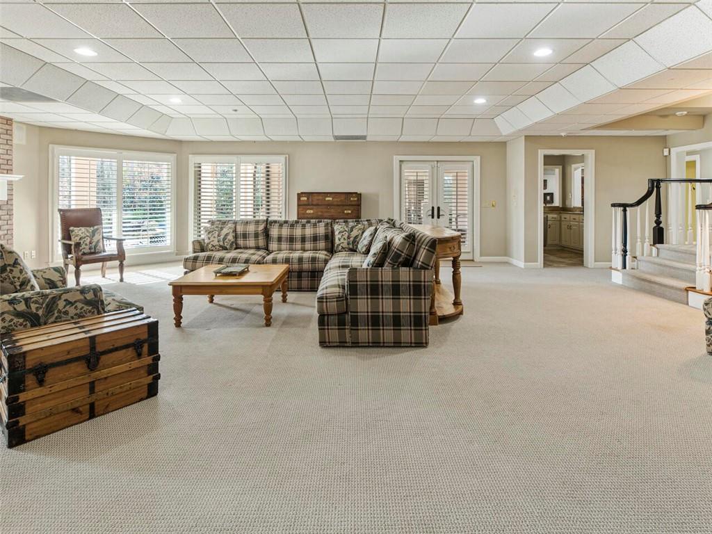 Another spacious gathering spot in the terrace level with French doors leading to patio