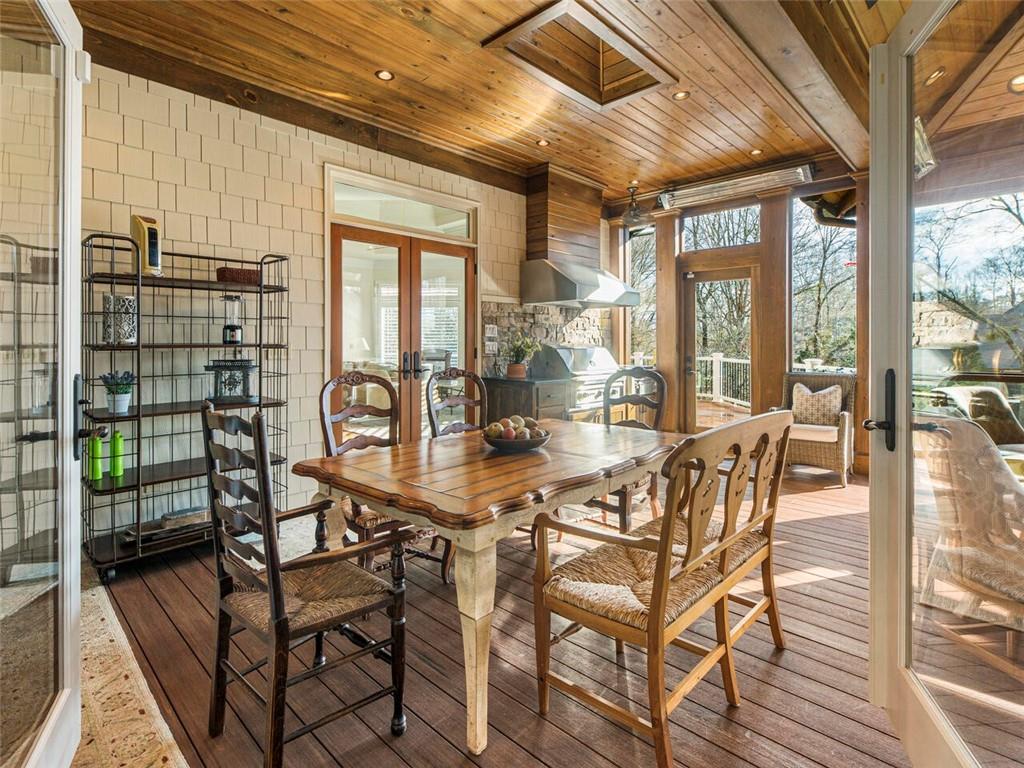 Screened in porch is surrounded by French doors for easy entertainment