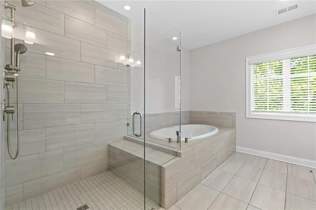 Shower and soaking tub in the Primary Bathroom