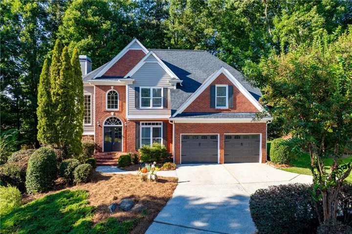 Brick and siding exterior with a two-car garage