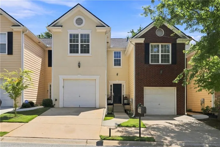 Stucco exterior with garage
