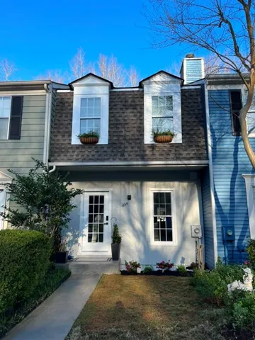 Grey shingle roof with two dormer windows
