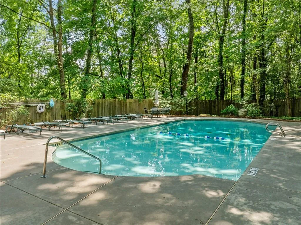Community pool featuring a patio area