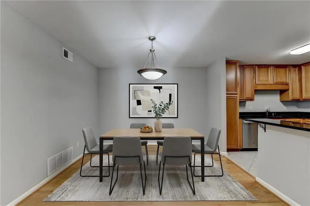 Dining space with light wood-type flooring and baseboards