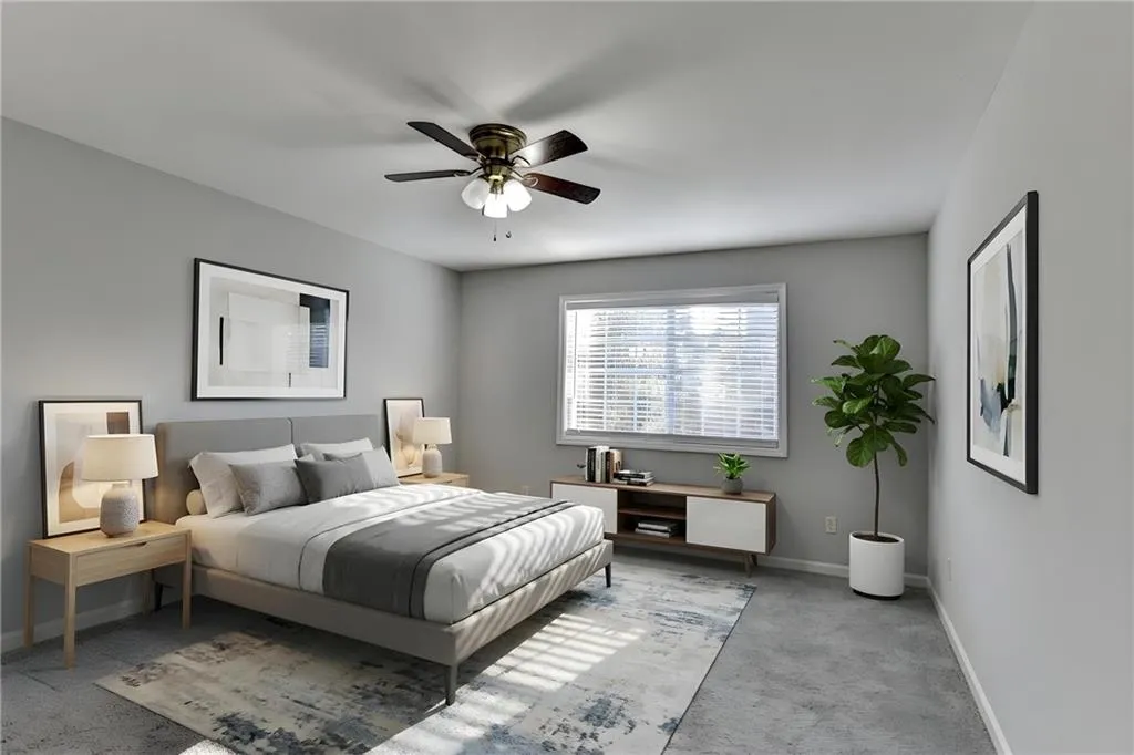 Bedroom featuring light carpet and ceiling fan
