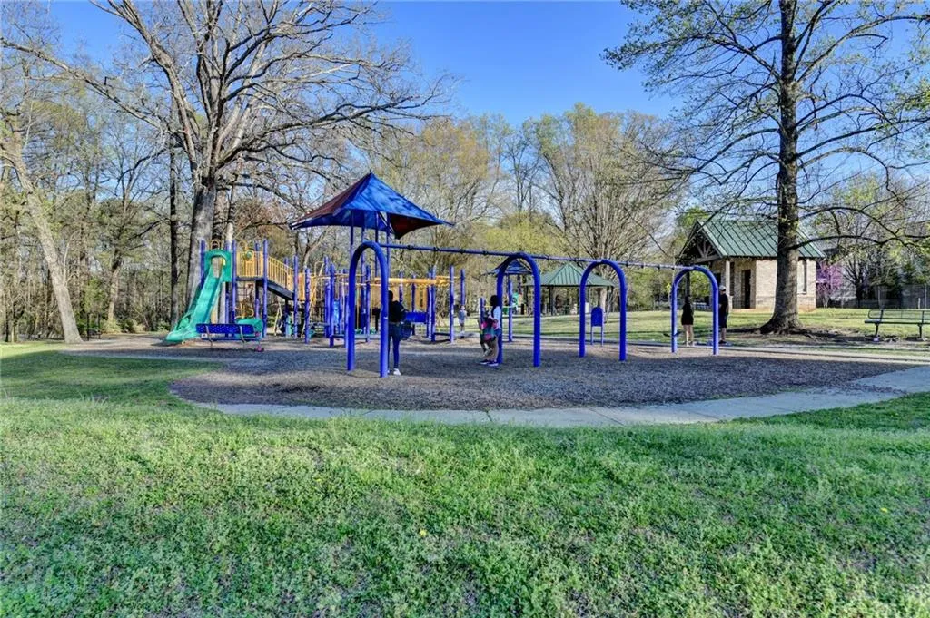 Community jungle gym featuring a yard