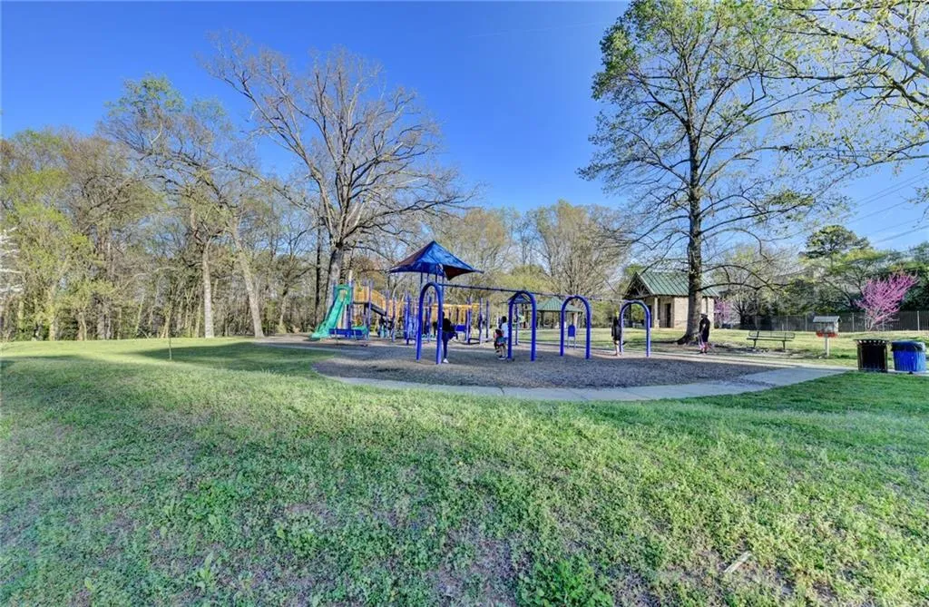 Community playground featuring a lawn