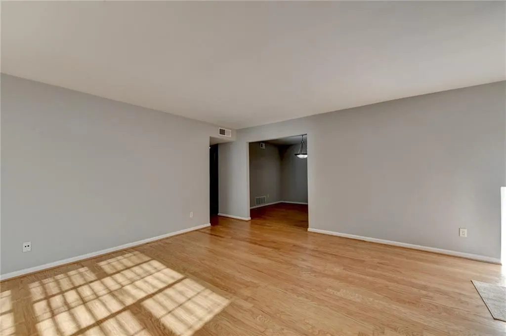 Spare room with light wood-style flooring and baseboards