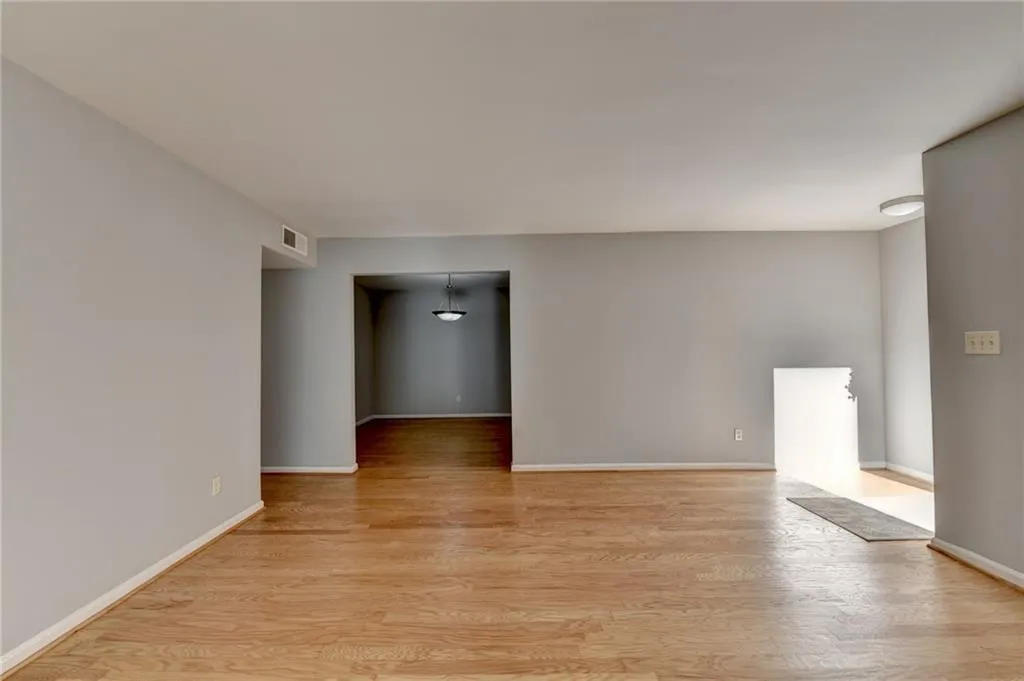 Empty room featuring light wood-type flooring and baseboards