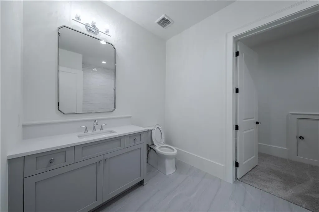 Bathroom with vanity and toilet