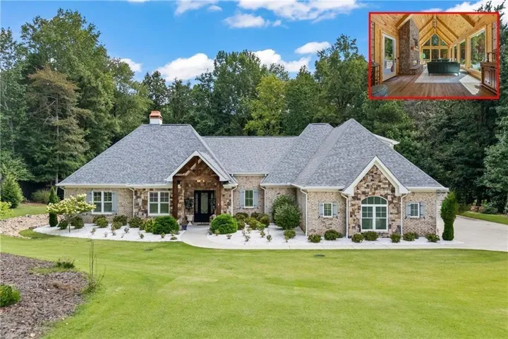 Brick and stone facade with a shingle roof