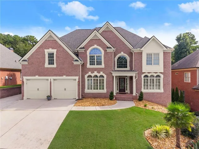 Brick exterior with multiple gables and white trim accents