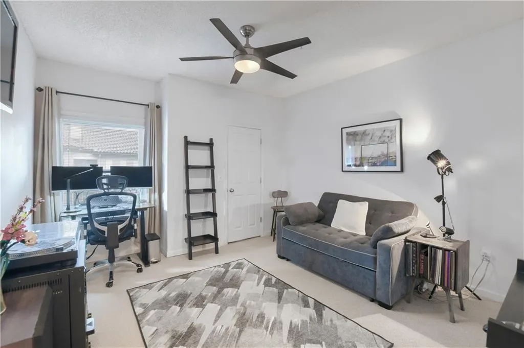 Bedroom featuring carpet and a ceiling fan