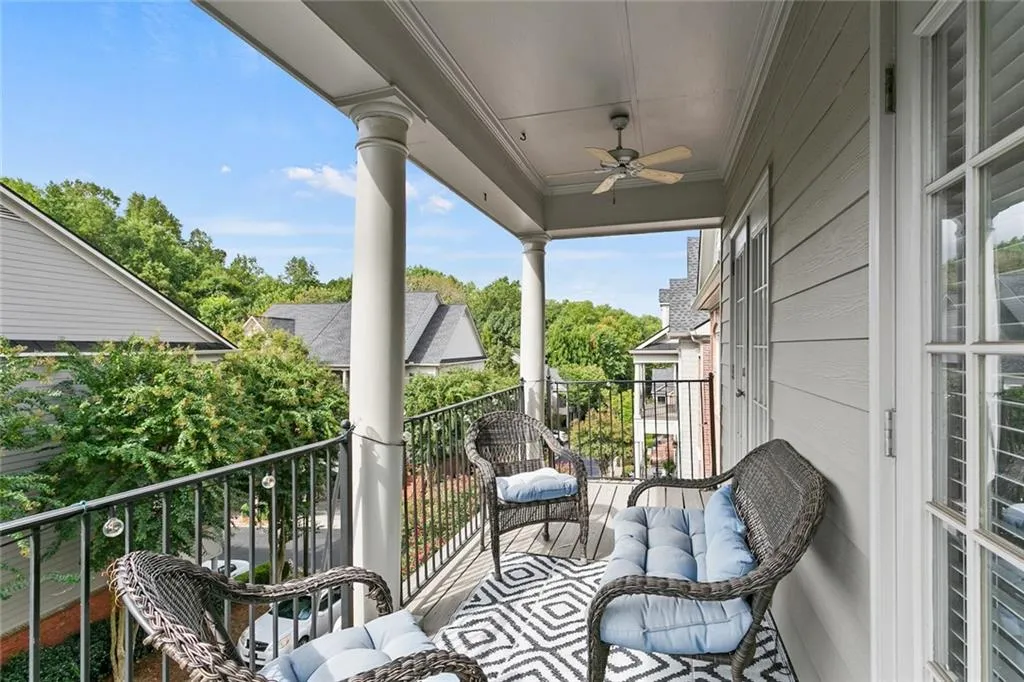 Balcony featuring ceiling fan