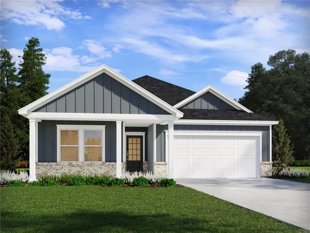 Siding exterior with stone accents, covered entry, and a two-car garage