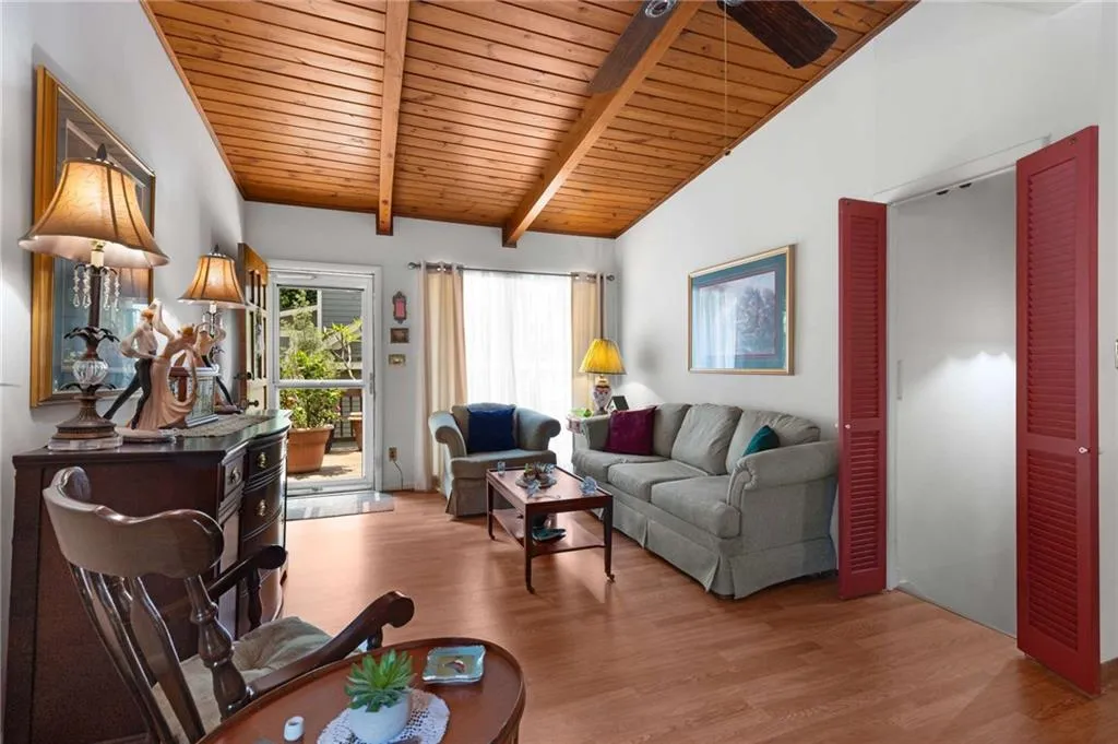 Living area featuring wooden ceiling and wood finished floors