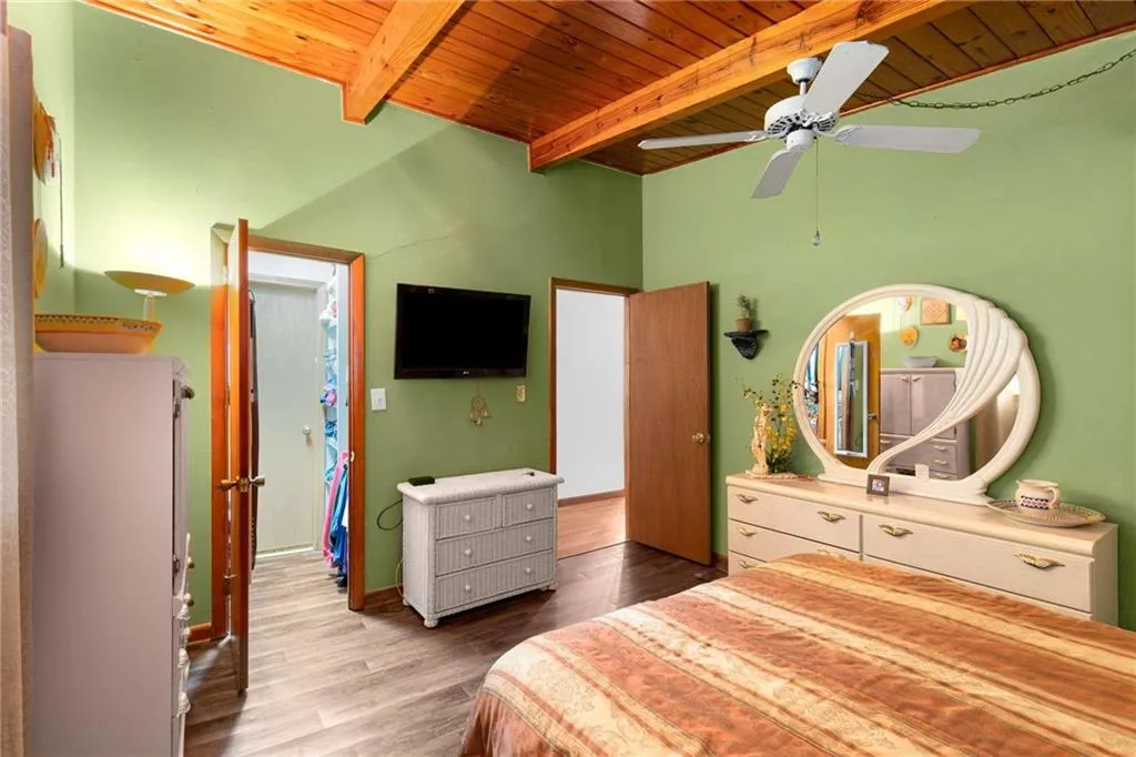Bedroom featuring wood ceiling and wood finished floors