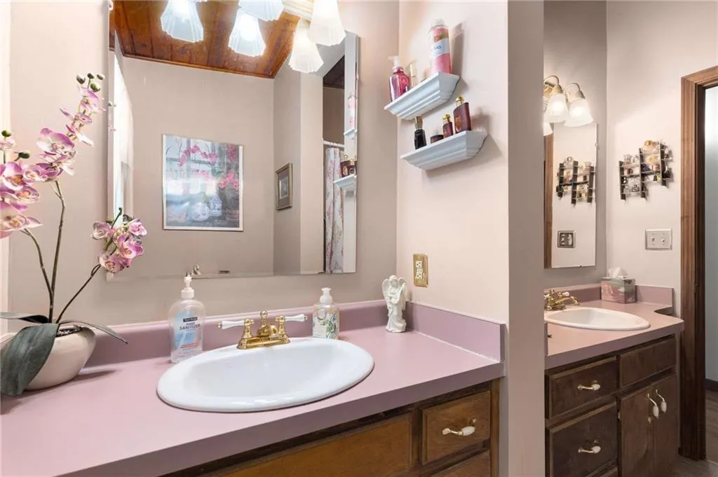 Bathroom featuring two vanities