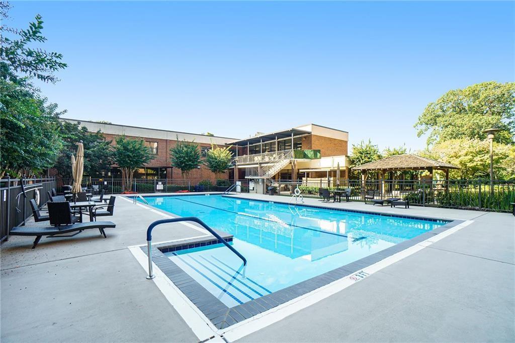 View of swimming pool with a patio and a gazebo