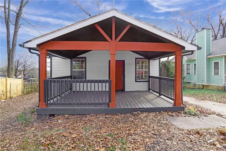 Back of property featuring a porch
