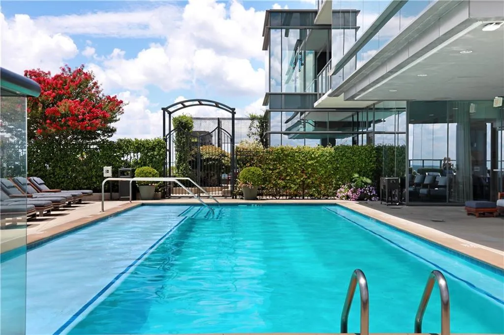 Community pool featuring a patio area