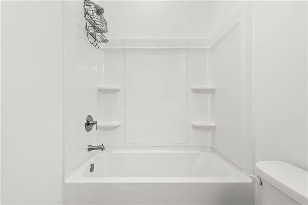 Upstairs Full bathroom featuring bathing tub / shower combination
