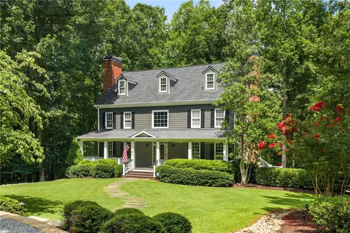 Set back on tree lined drive, privacy awaits. Welcome home!