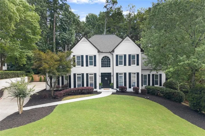 Two-story foyer filled with natural light and a welcoming sense of arrival.