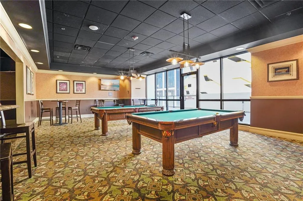 Recreation room featuring pool table, wallpapered walls, a paneled ceiling, and a wainscoted wall