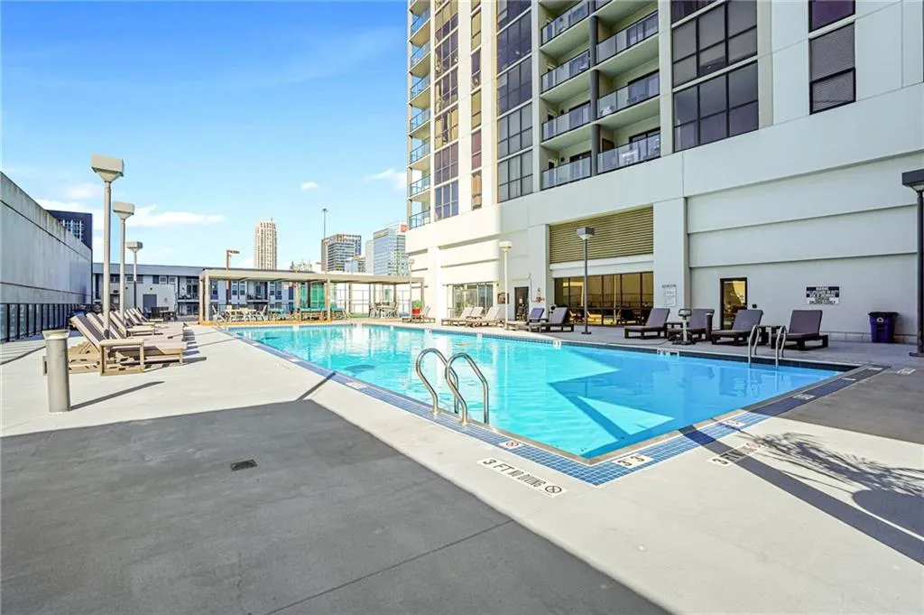 Community pool with a patio