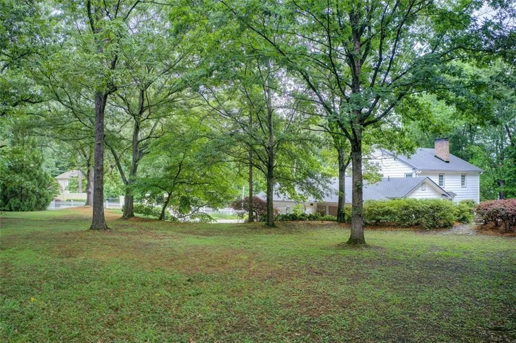 Flat backyard to make your own. Lots of space here to call your own.