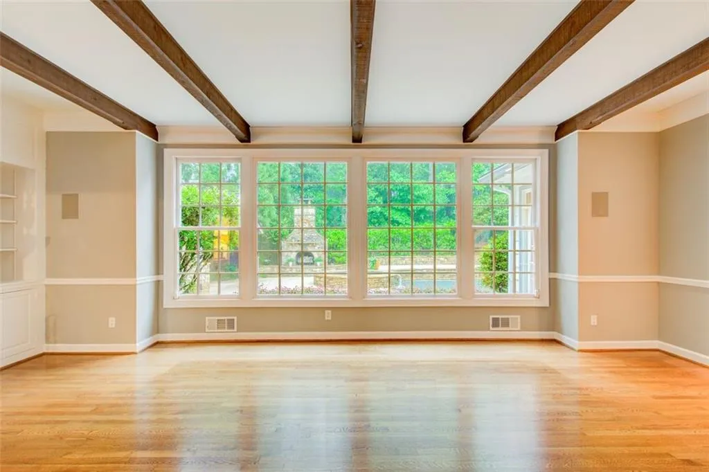 The fireside living room has beautiful views of the outdoor oasis.