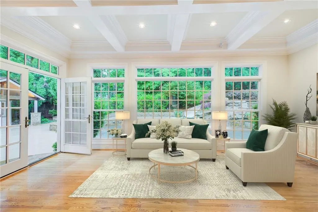 Virtually staged. This coffered ceiling keeping room is a room for the entire family to enjoy.