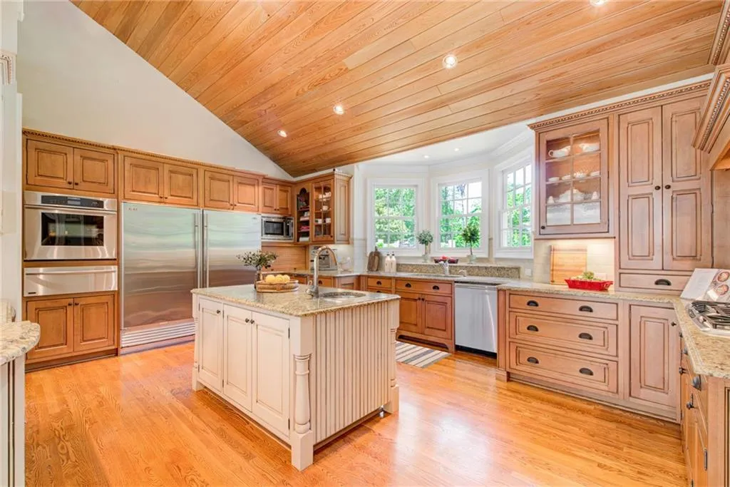 Chef's kitchen with luxury appliances, granite countertops and custom cabinetry. Plenty of room for multiple chef's.