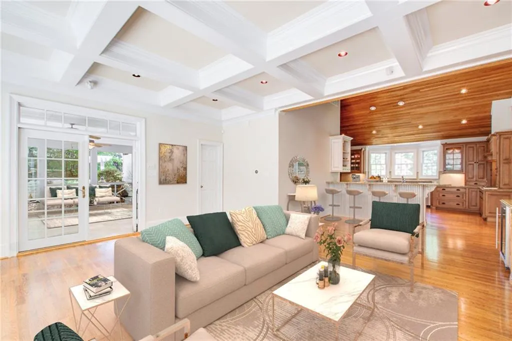 Virtually staged. The keeping room in open to the kitchen and screened in porch.