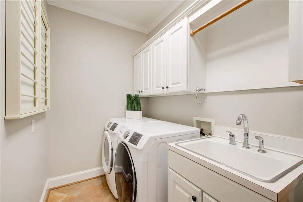 This laundry room  is right off mud room. Great planned spaces.