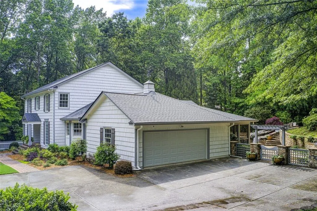 New exterior paint,  large side garage, parking pad and a beautiful back yard.