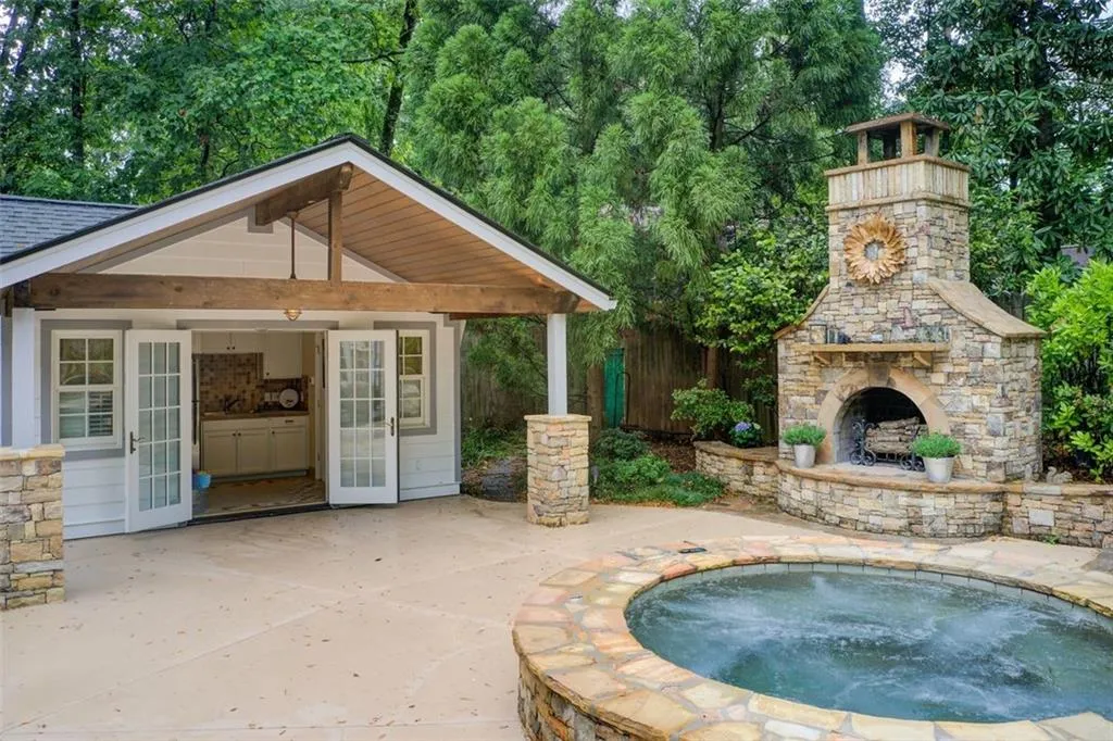 This is an entertainers dream home! Pool house with full bath and kitchenette, spa  and outdoor fireplace.